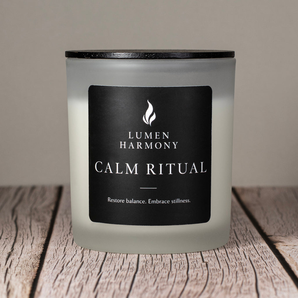 Lumen Harmony candle with a black label on a wooden surface