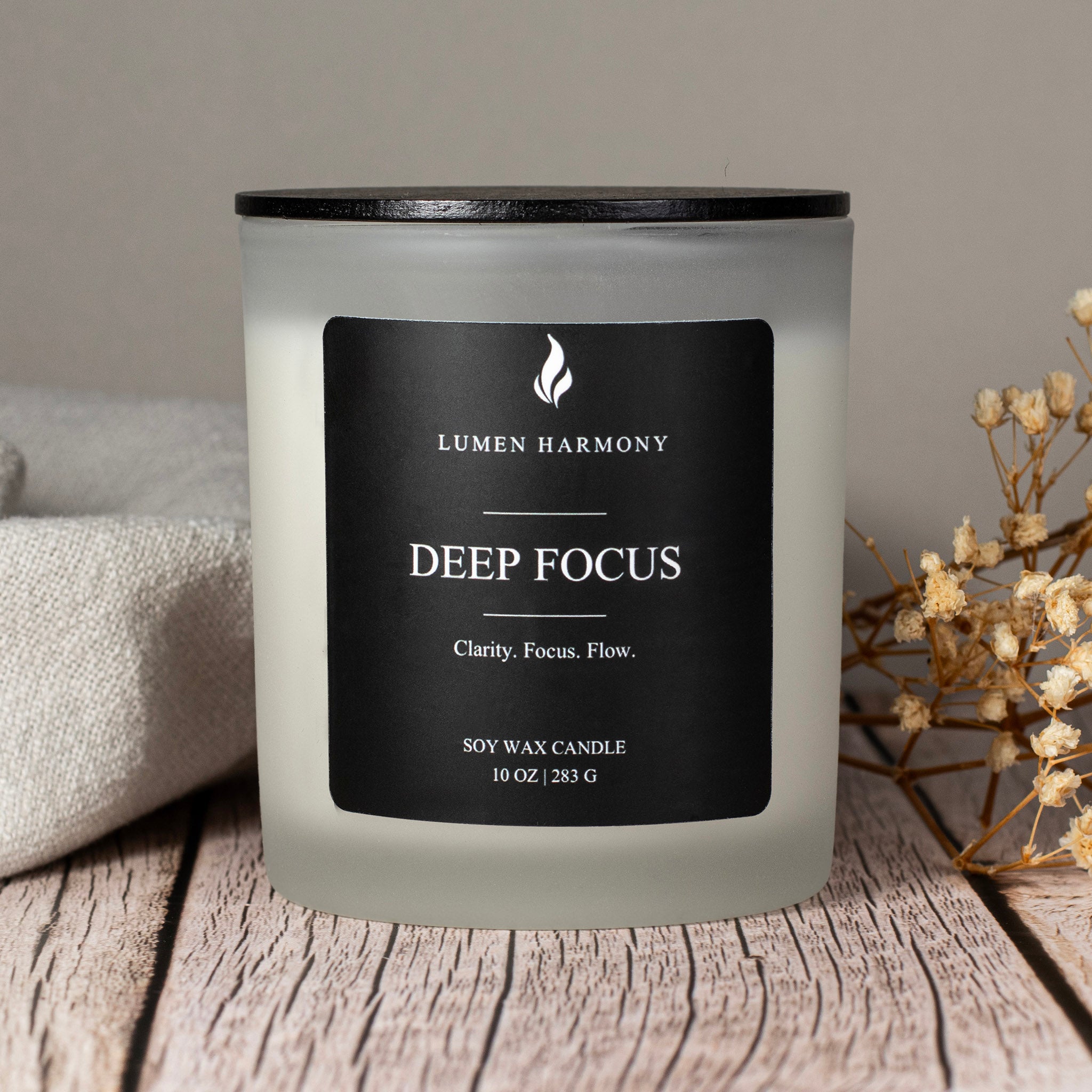 Lumen Harmony Deep Focus candle on a wooden surface with a neutral background