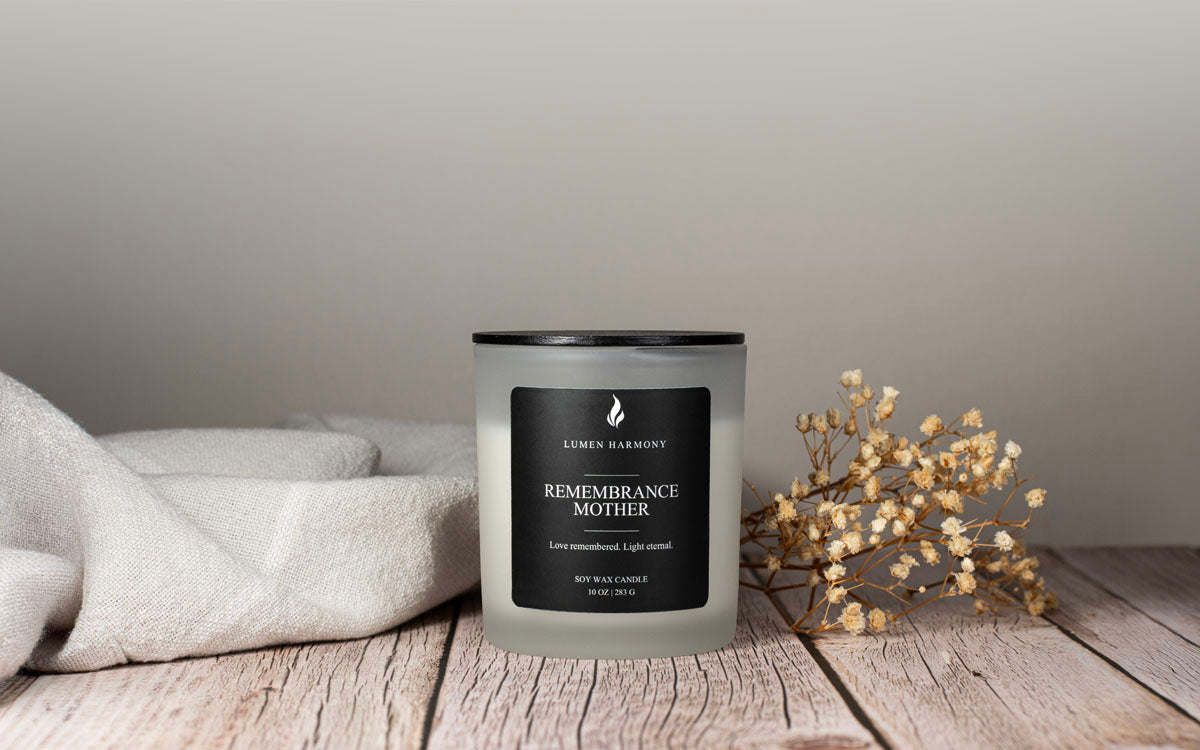 Lumen Harmony Candle with 'Remembrance Mother' label on a wooden surface with neutral background