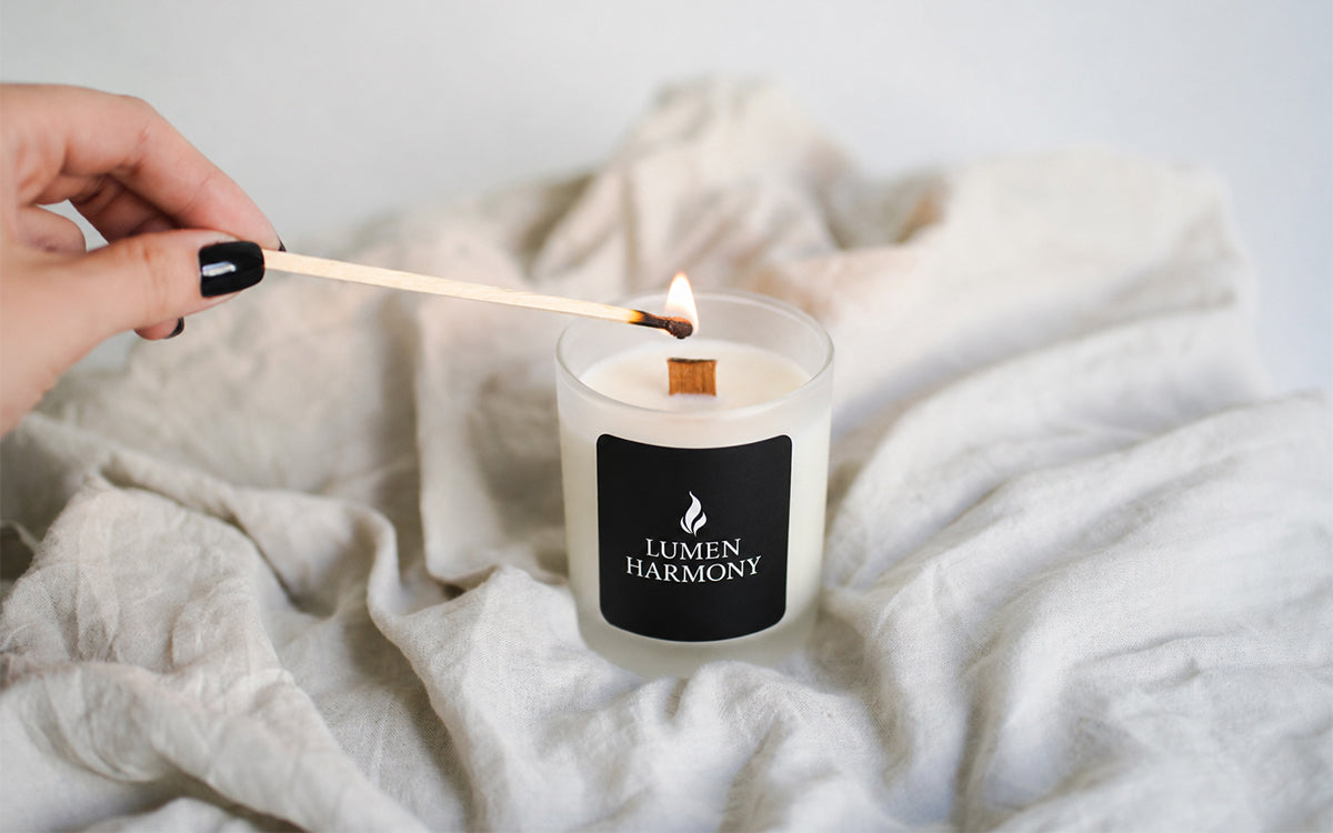 A woman hand lighting a candle