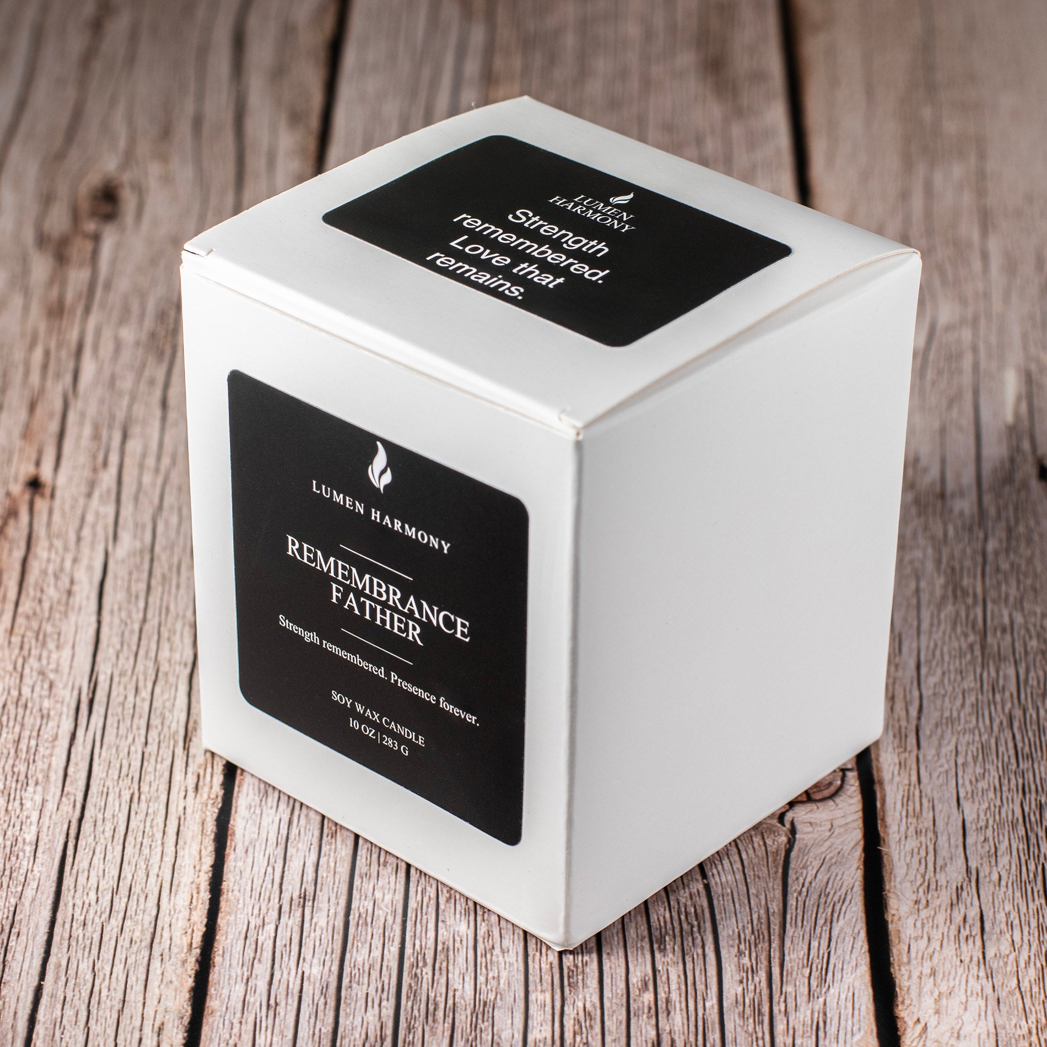 Candle packaging with 'Lumen Harmony' branding on a wooden surface