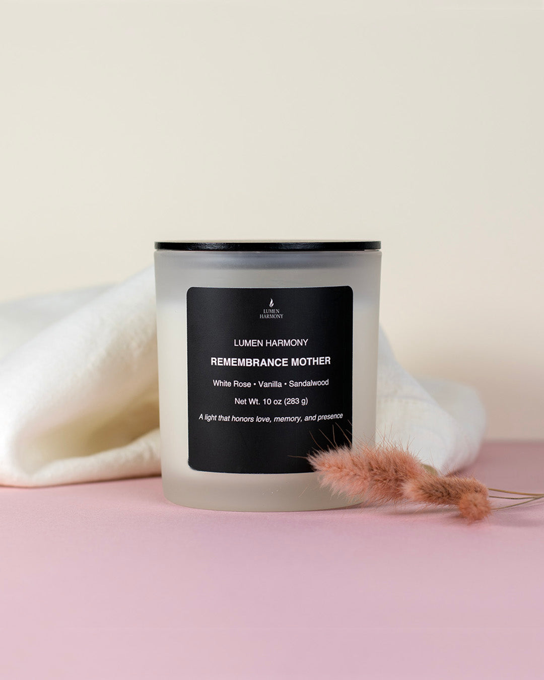 A candle for mom over a neutral background