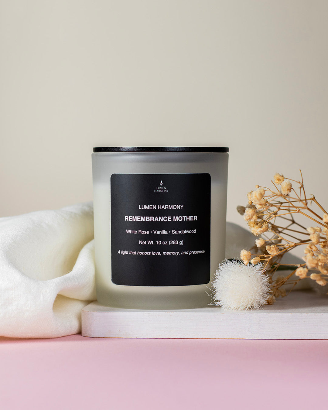 A candle called "Remembrance Mother" with decorations